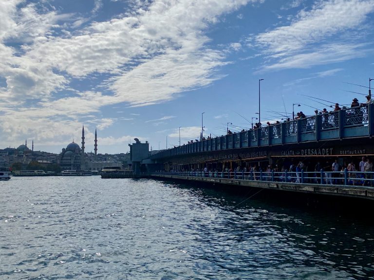 Galata Bridge lined by fishermen and restaurants serving traditional Istanbul food