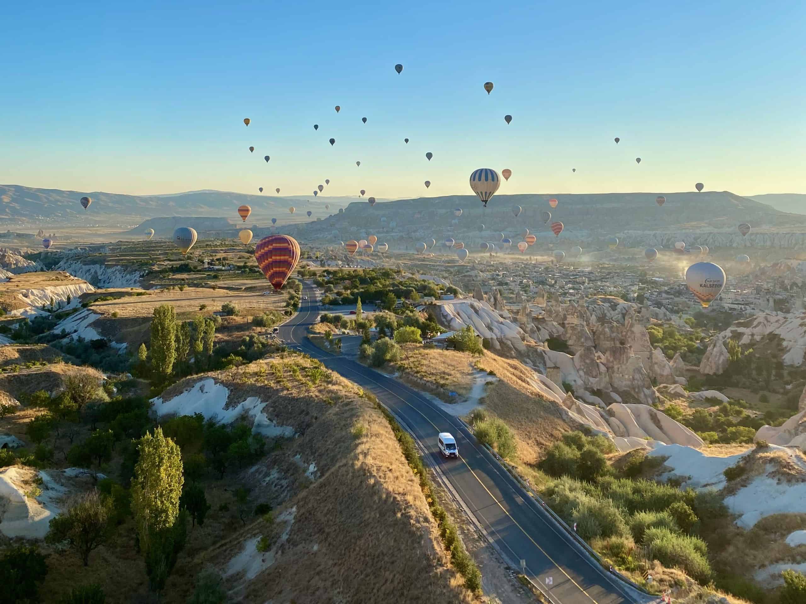 Air balloon over a road leading to Göreme in Cappadocia